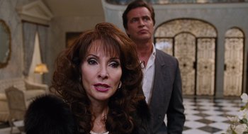 Movie still from “Joy” (2015), directed by David O. Russell – A man and a woman standing next to each other; Close Up shot, Over the shoulder angle