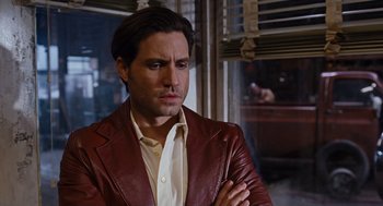 Movie still from “Joy” (2015), directed by David O. Russell – A person wearing a jacket; Close Up shot, Over the shoulder angle