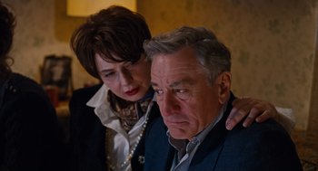 Movie still from “Joy” (2015), directed by David O. Russell – An older man and a younger woman looking at each other; Close Up shot, Low angle