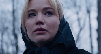 Movie still from “Joy” (2015), directed by David O. Russell – A person wearing a hooded jacket; Close Up shot, Low angle