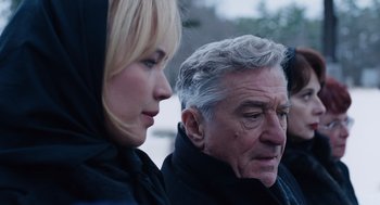 Movie still from “Joy” (2015), directed by David O. Russell – A man and a woman looking at each other; Close Up shot, Over the shoulder angle