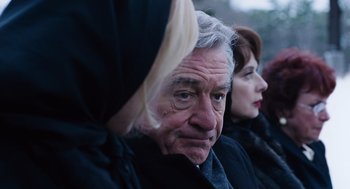 Movie still from “Joy” (2015), directed by David O. Russell – An older man and a younger woman looking at something; Close Up shot, Over the shoulder angle