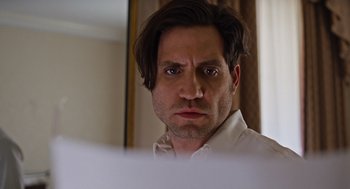 Movie still from “Joy” (2015), directed by David O. Russell – A person wearing a white shirt; Close Up shot, Low angle