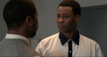 Movie still from “Just Mercy” (2019), directed by Destin Daniel Cretton – Two men talking to each other in front of a mirror; Close Up shot, Over the shoulder angle