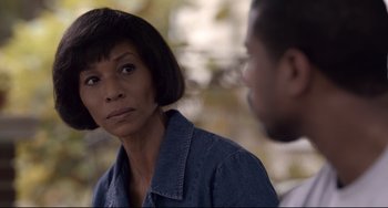 Movie still from “Just Mercy” (2019), directed by Destin Daniel Cretton – A woman in a denim jacket is looking at a man in a blue shirt; Close Up shot, Over the shoulder angle