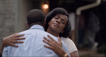 Movie still from “Just Mercy” (2019), directed by Destin Daniel Cretton – A man and a woman embracing each other; Close Up shot, Over the shoulder angle