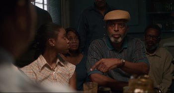 Movie still from “Just Mercy” (2019), directed by Destin Daniel Cretton – An older man talking to a young girl; Medium shot, Over the shoulder angle