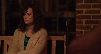 Movie still from “Just Mercy” (2019), directed by Destin Daniel Cretton – A woman sitting on a chair in front of a wooden swing; Medium shot, Over the shoulder angle