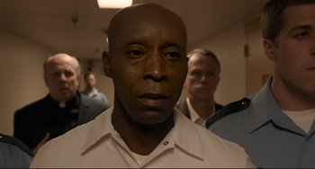 Movie still from “Just Mercy” (2019), directed by Destin Daniel Cretton – A person wearing a white shirt; Close Up shot, Low angle