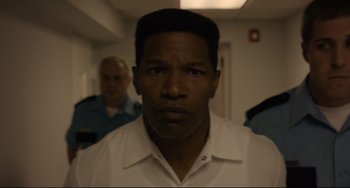 Movie still from “Just Mercy” (2019), directed by Destin Daniel Cretton – A person wearing a white shirt; Close Up shot, Low angle