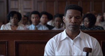 Movie still from “Just Mercy” (2019), directed by Destin Daniel Cretton – A man in a courtroom with his eyes closed; Close Up shot, Over the shoulder angle