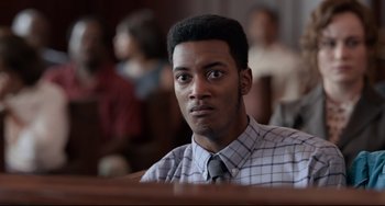Movie still from “Just Mercy” (2019), directed by Destin Daniel Cretton – A man in a courtroom with a tie on looking at the camera; Close Up shot, Over the shoulder angle