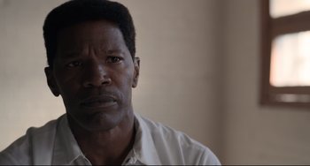Movie still from “Just Mercy” (2019), directed by Destin Daniel Cretton – A person wearing a white shirt; Close Up shot, Over the shoulder angle