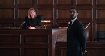Movie still from “Just Mercy” (2019), directed by Destin Daniel Cretton – A man standing in front of a judge in a courtroom; Medium shot, Over the shoulder angle