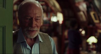 Movie still from “Knives Out” (2019), directed by Rian Johnson – An old man with a beard and a vest; Close Up shot, Over the shoulder angle