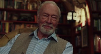 Movie still from “Knives Out” (2019), directed by Rian Johnson – An older man wearing a blue shirt and a vest; Close Up shot, Over the shoulder angle