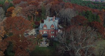 Movie still from “Knives Out” (2019), directed by Rian Johnson – An aerial view of a large house surrounded by trees; Extreme Wide shot, High angle