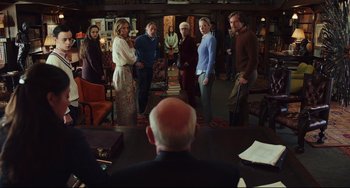 Movie still from “Knives Out” (2019), directed by Rian Johnson – A group of people standing in a room with books; Wide shot, Over the shoulder angle