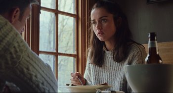 Movie still from “Knives Out” (2019), directed by Rian Johnson – A woman sitting in front of a bowl of food; Close Up shot, Over the shoulder angle