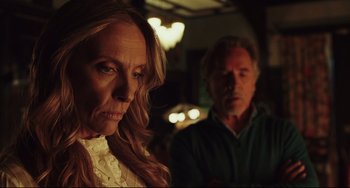 Movie still from “Knives Out” (2019), directed by Rian Johnson – A woman and a man standing next to each other in a room; Close Up shot, Over the shoulder angle