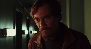 Movie still from “Knives Out” (2019), directed by Rian Johnson – A person with a beard; Close Up shot, Low angle