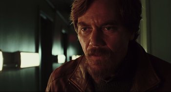 Movie still from “Knives Out” (2019), directed by Rian Johnson – A person with a beard; Close Up shot, Low angle