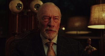 Movie still from “Knives Out” (2019), directed by Rian Johnson – An older man wearing a suit and a tie; Close Up shot, Low angle