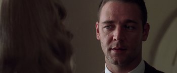 Movie still from “L.A. Confidential” (1997), directed by Curtis Hanson – A person looking at the camera; Close Up shot, Low angle