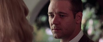 Movie still from “L.A. Confidential” (1997), directed by Curtis Hanson – A man's face in front of a car window; Close Up shot, Low angle