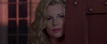 Movie still from “L.A. Confidential” (1997), directed by Curtis Hanson – A beautiful woman with blonde hair and blue eyes; Close Up shot, Over the shoulder angle