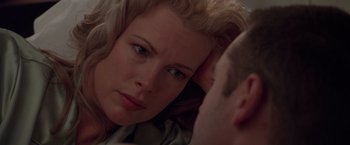 Movie still from “L.A. Confidential” (1997), directed by Curtis Hanson – A person lying on a bed; Close Up shot, Over the shoulder angle