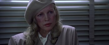 Movie still from “L.A. Confidential” (1997), directed by Curtis Hanson – A person wearing a hat; Close Up shot, Over the shoulder angle