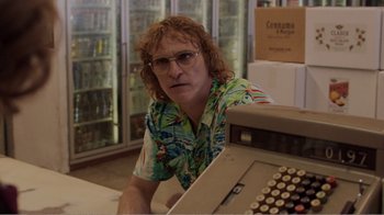 Movie still from “Don't Worry, He Won't Get Far on Foot” (2018), directed by Gus Van Sant – A person sitting in front of an old fashioned typewriter; Medium shot, Over the shoulder angle