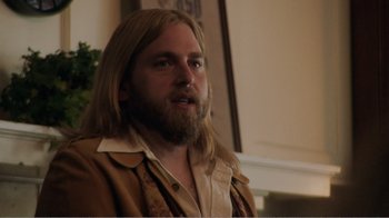 Movie still from “Don't Worry, He Won't Get Far on Foot” (2018), directed by Gus Van Sant – A man with long hair and a long beard; Close Up shot, Over the shoulder angle