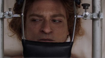 Movie still from “Don't Worry, He Won't Get Far on Foot” (2018), directed by Gus Van Sant – A person with a black bag over their face; Extreme Close Up shot, Overhead angle