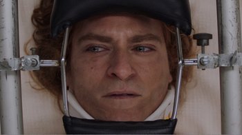 Movie still from “Don't Worry, He Won't Get Far on Foot” (2018), directed by Gus Van Sant – A person with a helmet on; Extreme Close Up shot, Overhead angle