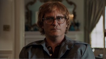 Movie still from “Don't Worry, He Won't Get Far on Foot” (2018), directed by Gus Van Sant – A person wearing glasses; Close Up shot, Low angle
