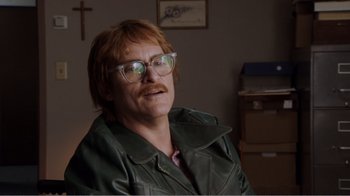 Movie still from “Don't Worry, He Won't Get Far on Foot” (2018), directed by Gus Van Sant – A man with glasses and a red beard wearing a green jacket; Close Up shot, Low angle