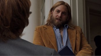 Movie still from “Don't Worry, He Won't Get Far on Foot” (2018), directed by Gus Van Sant – A man with long blond hair and a beard talking to another man; Medium shot, Over the shoulder angle