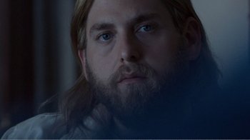 Movie still from “Don't Worry, He Won't Get Far on Foot” (2018), directed by Gus Van Sant – A person with long hair and a beard; Close Up shot, Over the shoulder angle