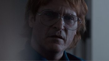 Movie still from “Don't Worry, He Won't Get Far on Foot” (2018), directed by Gus Van Sant – A person wearing glasses; Close Up shot, Low angle