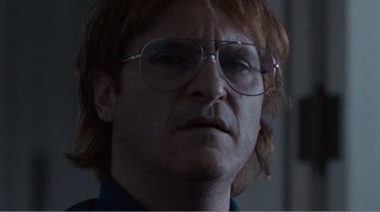 Movie still from “Don't Worry, He Won't Get Far on Foot” (2018), directed by Gus Van Sant – A person wearing glasses; Close Up shot, Low angle