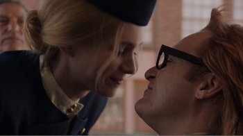 Movie still from “Don't Worry, He Won't Get Far on Foot” (2018), directed by Gus Van Sant – A man and a woman face to face in front of a brick wall; Close Up shot, Low angle