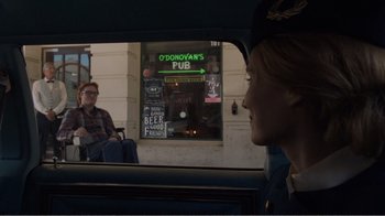Movie still from “Don't Worry, He Won't Get Far on Foot” (2018), directed by Gus Van Sant – A woman sitting in the back seat of a car; Wide shot, Over the shoulder angle