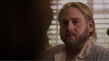 Movie still from “Don't Worry, He Won't Get Far on Foot” (2018), directed by Gus Van Sant – A person with long hair and a beard; Close Up shot, Over the shoulder angle