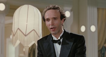 Movie still from “Life Is Beautiful” (1997), directed by Roberto Benigni – A man in a suit and bow tie; Close Up shot, Low angle