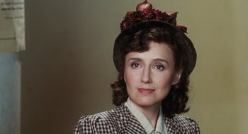 Movie still from “Life Is Beautiful” (1997), directed by Roberto Benigni – A person wearing a hat; Close Up shot, Over the shoulder angle