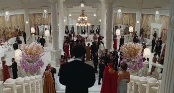 Movie still from “Life Is Beautiful” (1997), directed by Roberto Benigni – A group of people standing in a large room; Extreme Wide shot, High angle