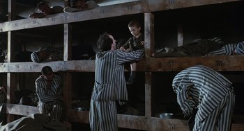 Movie still from “Life Is Beautiful” (1997), directed by Roberto Benigni – A man and a child in a jail cell; Wide shot, High angle