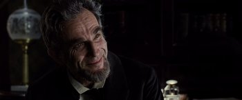 Movie still from “Lincoln” (2012), directed by Steven Spielberg – An older man with a beard and a suit; Close Up shot, Over the shoulder angle